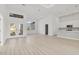 Open-concept living room featuring recessed lighting, light flooring, and access to the kitchen at 2551 Alhaven Ter, North Port, FL 34286