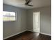 Bedroom featuring hardwood floors, a ceiling fan, and natural light at 702 Desert Hills Way, Sun City Center, FL 33573