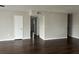 Open living room featuring hardwood floors, great natural light and neutral colored walls at 702 Desert Hills Way, Sun City Center, FL 33573