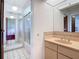 Full bathroom featuring a shower and tub combo with glass doors and vanity at 1481 Newton St, Port Charlotte, FL 33952