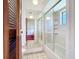 Full bathroom featuring a shower and tub combo with glass doors and tile flooring at 1481 Newton St, Port Charlotte, FL 33952