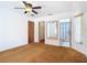 Bright bedroom featuring a ceiling fan, carpet flooring, and ensuite bathroom at 1481 Newton St, Port Charlotte, FL 33952