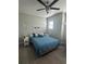 Bright bedroom with light-colored walls, fan and beach-themed decor at 2137 Apian Way, Port Charlotte, FL 33953