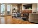 Comfortable living room with hardwood floors, plush seating, and modern entertainment center at 2806 W Shelton Ave, Tampa, FL 33611