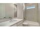 Modern bathroom with a tub/shower combination with tiled walls and a vanity with a countertop sink at 18213 Cresswind Ter, Lakewood Ranch, FL 34211