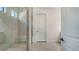 Modern bathroom with a walk-in shower, neutral tile, and a built-in bench at 18213 Cresswind Ter, Lakewood Ranch, FL 34211