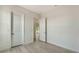 Bedroom featuring wood-look flooring, two doorways, a closet with sliding doors, and two electrical outlets at 18213 Cresswind Ter, Lakewood Ranch, FL 34211