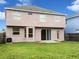 Exterior back view of home featuring a spacious yard and patio at 2007 Rain Dance Pl, Brandon, FL 33510