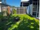 A cozy backyard with a fire pit and lush green lawn at 681 Dalton Blvd, Port Charlotte, FL 33952