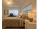 Bedroom with queen bed, blinds, and ceiling fan at 681 Dalton Blvd, Port Charlotte, FL 33952