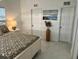 Bedroom with queen bed and a beach themed print at 681 Dalton Blvd, Port Charlotte, FL 33952