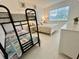 Bedroom with bunk beds and natural light at 681 Dalton Blvd, Port Charlotte, FL 33952
