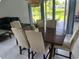 An open concept dining room with views of the backyard at 681 Dalton Blvd, Port Charlotte, FL 33952