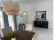 Inviting dining room with modern decor, stylish lighting, and views to the exterior at 681 Dalton Blvd, Port Charlotte, FL 33952