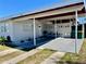Inviting home exterior shows a carport with design features and a well-kept lawn at 681 Dalton Blvd, Port Charlotte, FL 33952