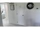 Bright hallway featuring a decorative mirror and clean white decor at 681 Dalton Blvd, Port Charlotte, FL 33952