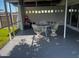 Cozy screened patio with seating arrangement perfect for relaxation and outdoor dining at 681 Dalton Blvd, Port Charlotte, FL 33952