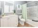 Well-lit bathroom with a vanity, toilet, and shower-tub combination with a decorative curtain at 10764 70Th Ave # 3305, Seminole, FL 33772