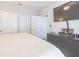 Bright bedroom featuring neutral tones, a large flat screen TV, and multiple closets for ample storage space at 10764 70Th Ave # 3305, Seminole, FL 33772