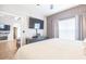 Spacious bedroom features a large bed, flat-screen TV, and a view into another room at 10764 70Th Ave # 3305, Seminole, FL 33772