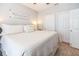 Spacious bedroom with plush bedding, neutral decor, and ample closet space at 10764 70Th Ave # 3305, Seminole, FL 33772