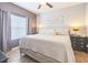 Comfortable bedroom featuring a cozy bed, soft lighting, and window with curtains at 10764 70Th Ave # 3305, Seminole, FL 33772