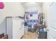 Walk-in closet with ample storage including multiple shelves, hanging racks, and a storage cabinet at 10764 70Th Ave # 3305, Seminole, FL 33772