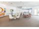 Spacious community room with kitchen, dining areas, and comfortable seating arrangements at 10764 70Th Ave # 3305, Seminole, FL 33772