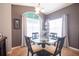 Inviting dining area with a glass table, stylish chairs, and bright windows for natural light at 10764 70Th Ave # 3305, Seminole, FL 33772