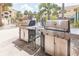 Close up of stainless steel grills with access to community pool at 10764 70Th Ave # 3305, Seminole, FL 33772