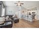 Open living area featuring a comfortable sofa, adjacent kitchen, and stylish decor at 10764 70Th Ave # 3305, Seminole, FL 33772