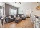 Comfortable living room with a large sectional sofa, ottoman, and neutral decor at 10764 70Th Ave # 3305, Seminole, FL 33772