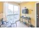 Cozy enclosed patio with comfortable seating and a view of the neighborhood at 10764 70Th Ave # 3305, Seminole, FL 33772