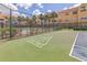 Shuffleboard area next to tennis court with lush landscaping and condo buildings in the background at 10764 70Th Ave # 3305, Seminole, FL 33772