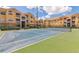 Spacious community tennis court offers a great recreational space surrounded by beautiful condo buildings at 10764 70Th Ave # 3305, Seminole, FL 33772