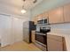 Efficient kitchen with stainless steel appliances and ample cabinet space at 12092 Rockford St, Spring Hill, FL 34608