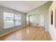 Bright living room featuring hardwood floors, neutral paint, and a large window for natural light at 12092 Rockford St, Spring Hill, FL 34608