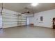 Spacious garage with an automatic door opener and smooth concrete flooring at 25242 Carnation Sedge Way, Land O Lakes, FL 34639