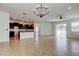 Spacious living room featuring tile floors, lots of natural light and modern ceiling fan at 25242 Carnation Sedge Way, Land O Lakes, FL 34639