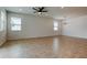 Expansive living room with neutral paint and floors is ready for your design ideas at 25242 Carnation Sedge Way, Land O Lakes, FL 34639