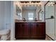 The main bathroom features a double vanity, granite counters, and a framed shower at 25242 Carnation Sedge Way, Land O Lakes, FL 34639