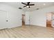 Spacious main bedroom with white walls, light floors, modern ceiling fan and natural light at 25242 Carnation Sedge Way, Land O Lakes, FL 34639