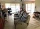 Living room with a couch, desk and chair, and large windows for natural light at 1420 Citrus St, Clearwater, FL 33756