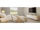 Cozy bedroom with a large window offering a view of the outdoors, complemented by stylish furniture at 2667 Malibu Ln, North Port, FL 34286