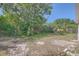 Backyard featuring a grassy area and a partial view of the fence at 7708 Belah Dr, New Port Richey, FL 34653
