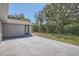 Backyard featuring a concrete patio and partial view of the fence and home at 7708 Belah Dr, New Port Richey, FL 34653