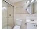 Well-maintained bathroom offers a walk-in shower, vanity sink and bright lighting at 7708 Belah Dr, New Port Richey, FL 34653