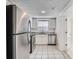Bright kitchen showcases stainless steel appliances and sleek cabinetry with a view to a doorway at 7708 Belah Dr, New Port Richey, FL 34653