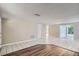 Spacious living room with tiled flooring and a sliding glass door to the backyard at 7708 Belah Dr, New Port Richey, FL 34653