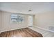 Bright living room featuring tiled flooring, wood accents, and natural light at 7708 Belah Dr, New Port Richey, FL 34653